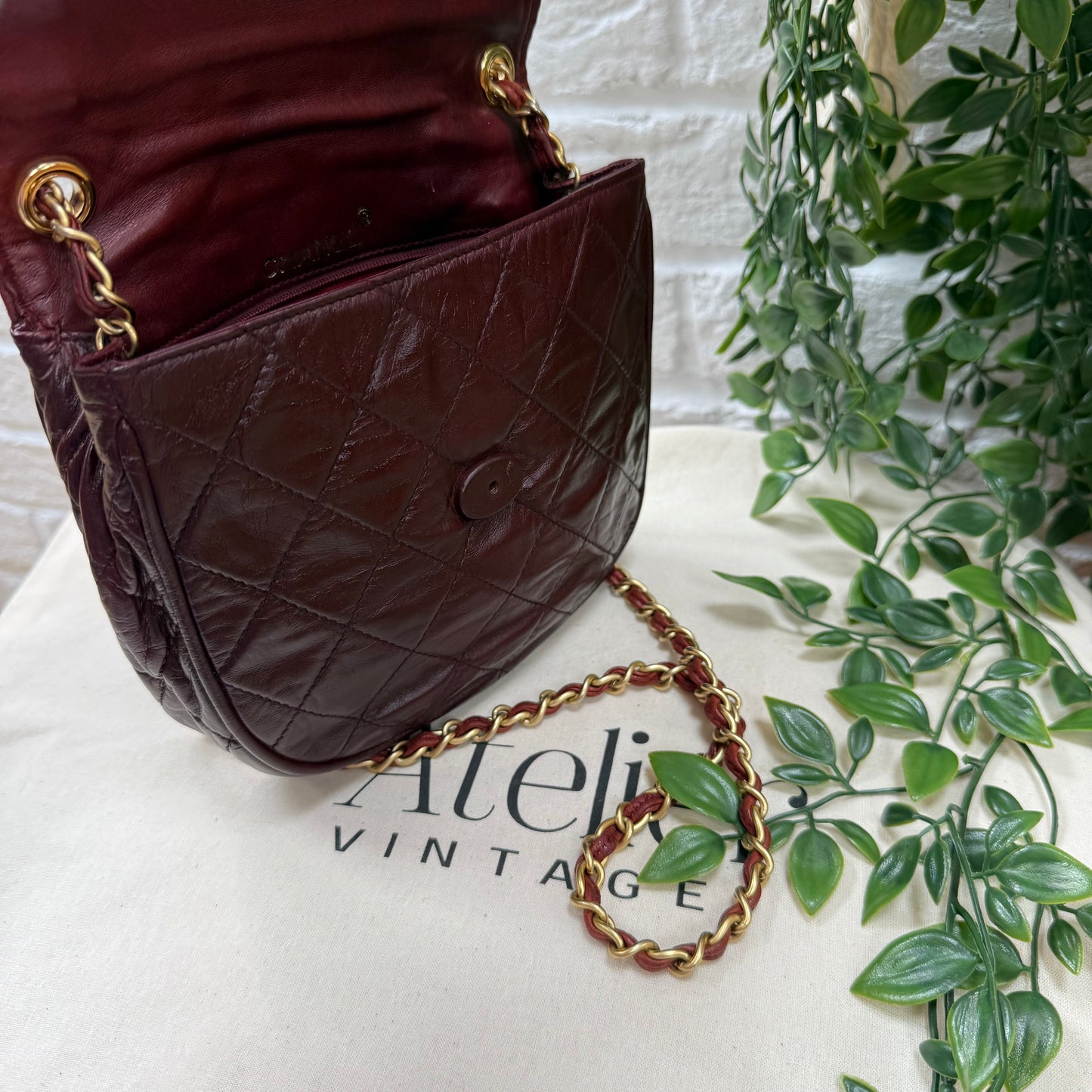 Chanel Early 1980s Bordeaux CC button half moon flap