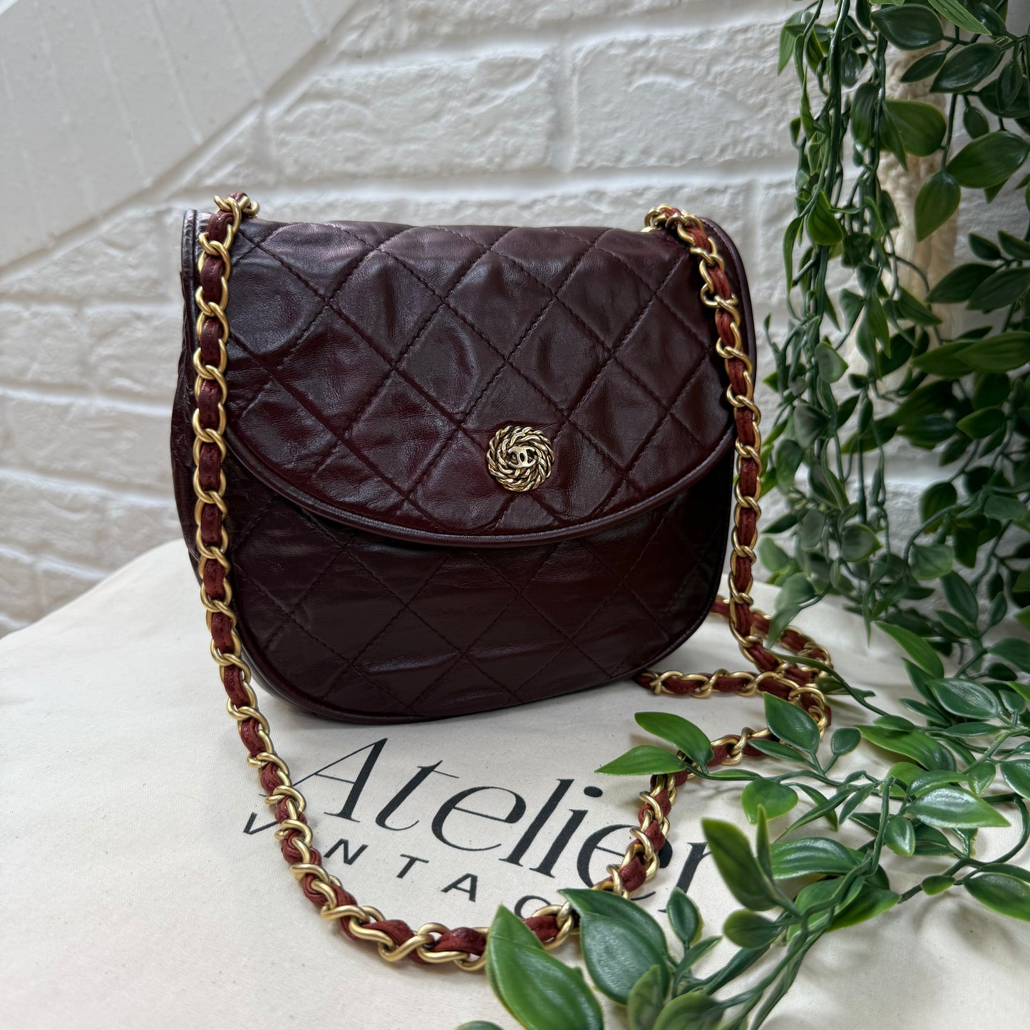 Chanel Early 1980s Bordeaux CC button half moon flap