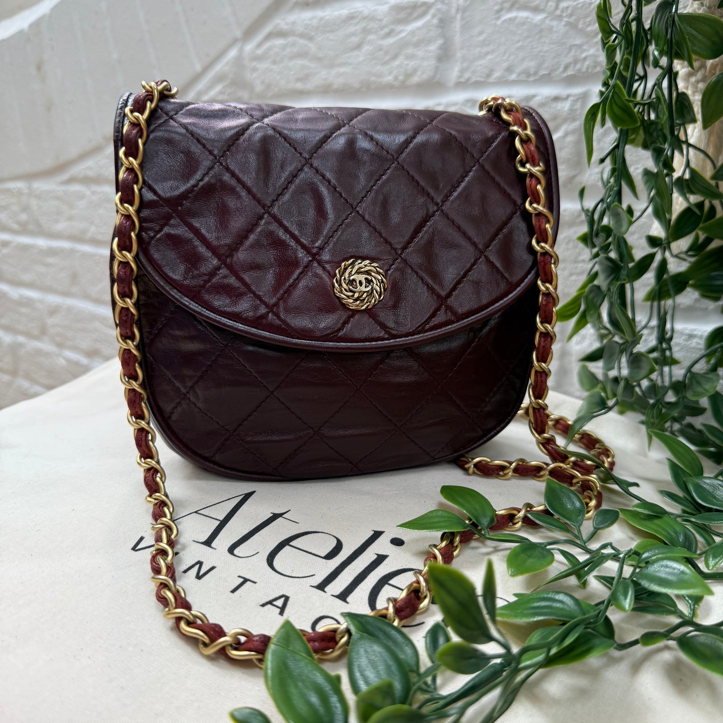 Chanel Early 1980s Bordeaux CC button half moon flap
