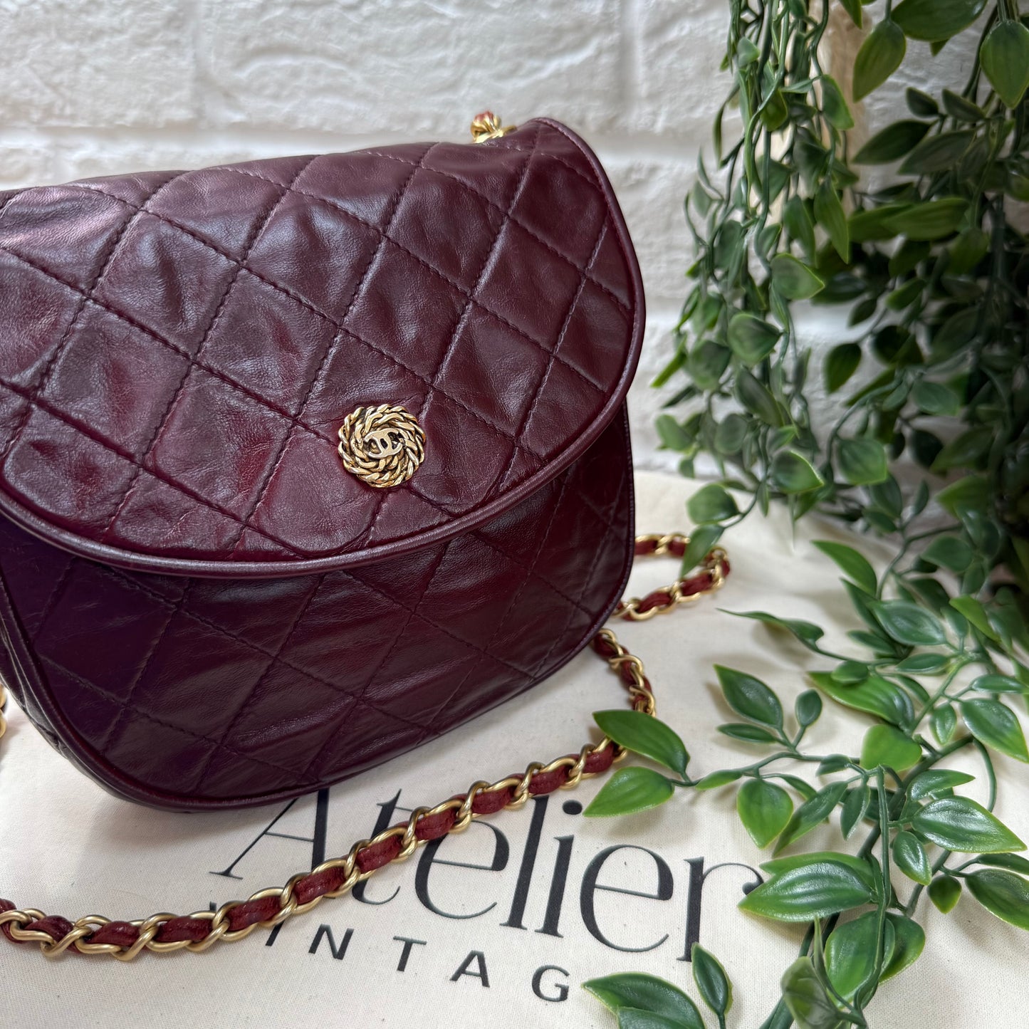 Chanel Early 1980s Bordeaux CC button half moon flap