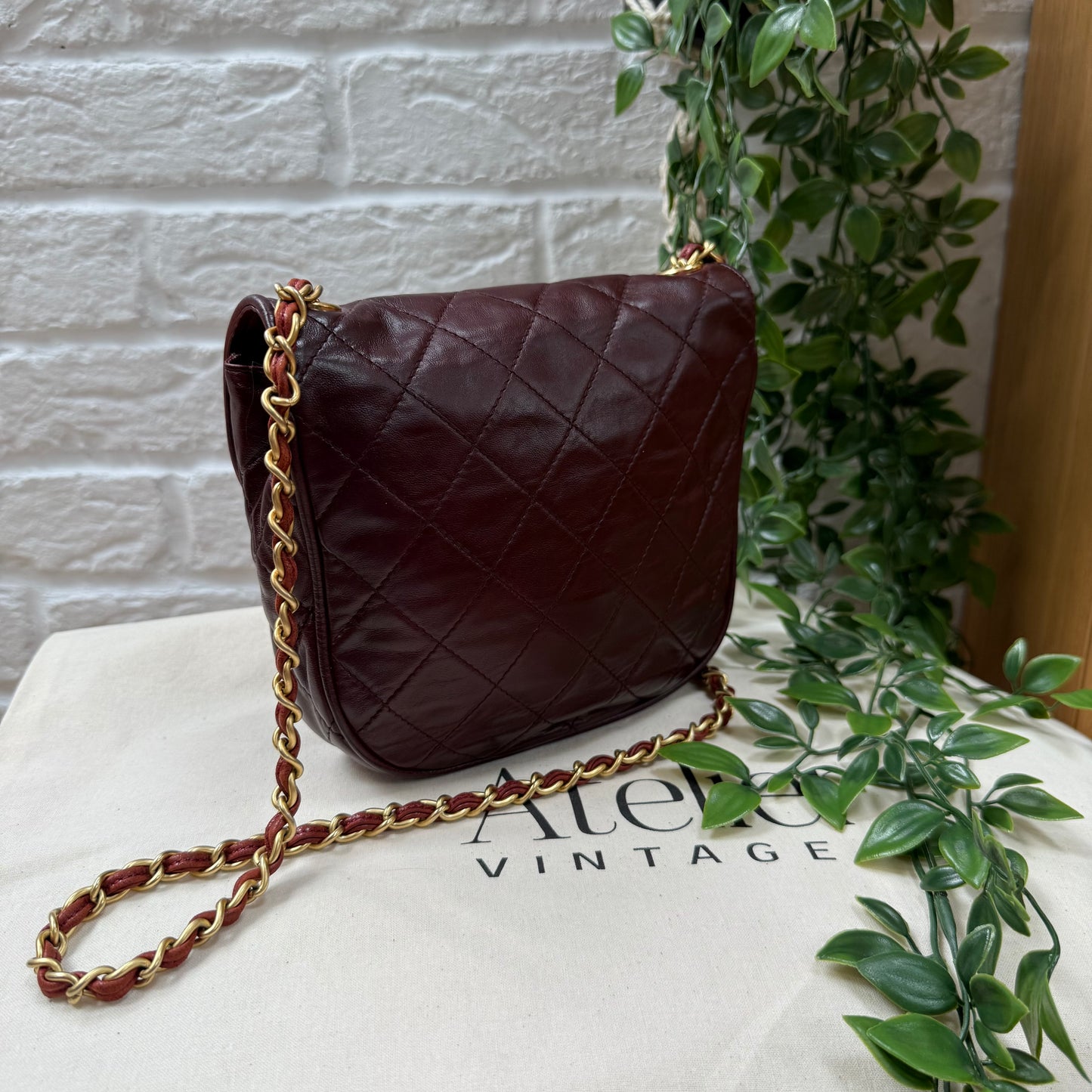 Chanel Early 1980s Bordeaux CC button half moon flap