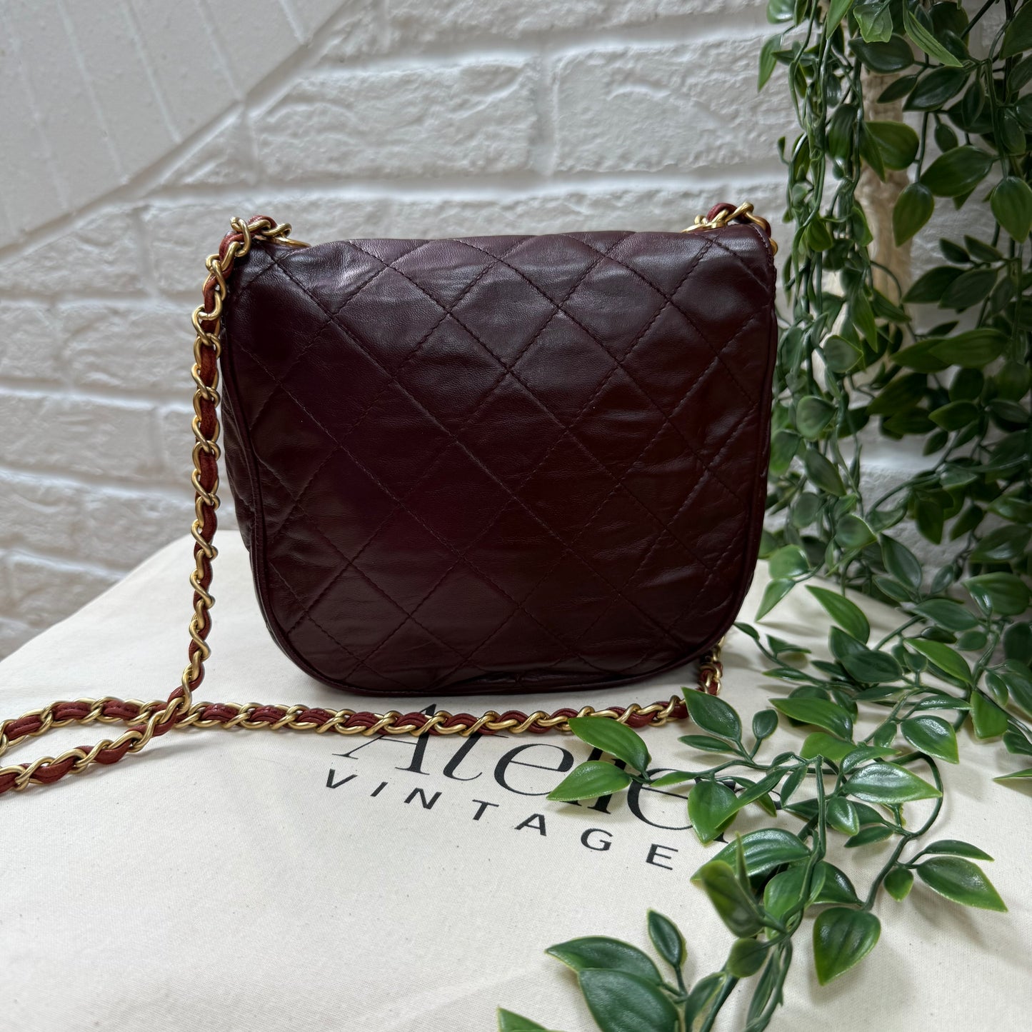 Chanel Early 1980s Bordeaux CC button half moon flap