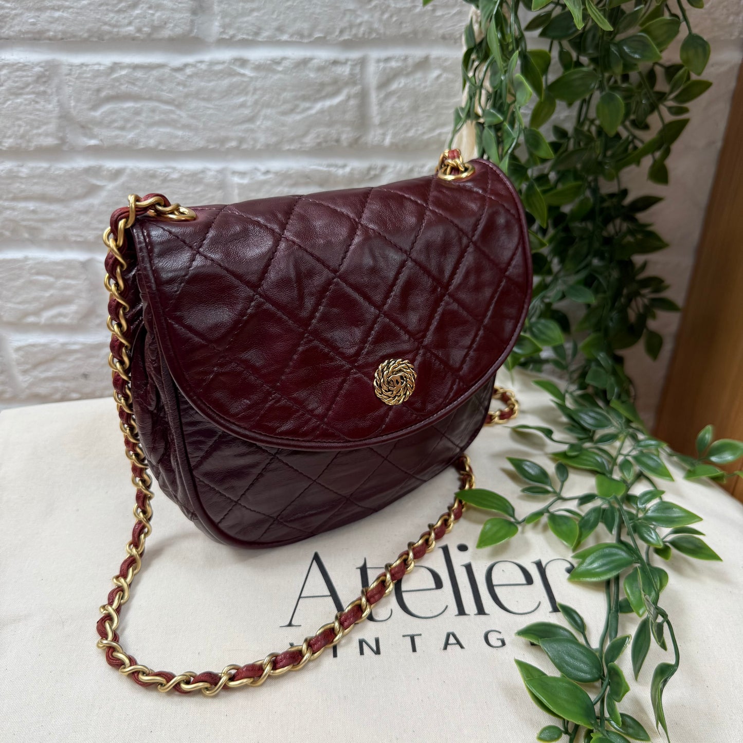 Chanel Early 1980s Bordeaux CC button half moon flap