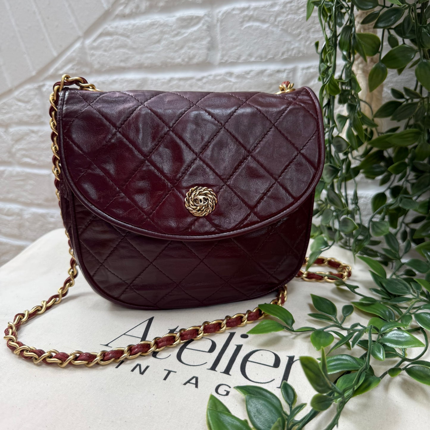 Chanel Early 1980s Bordeaux CC button half moon flap