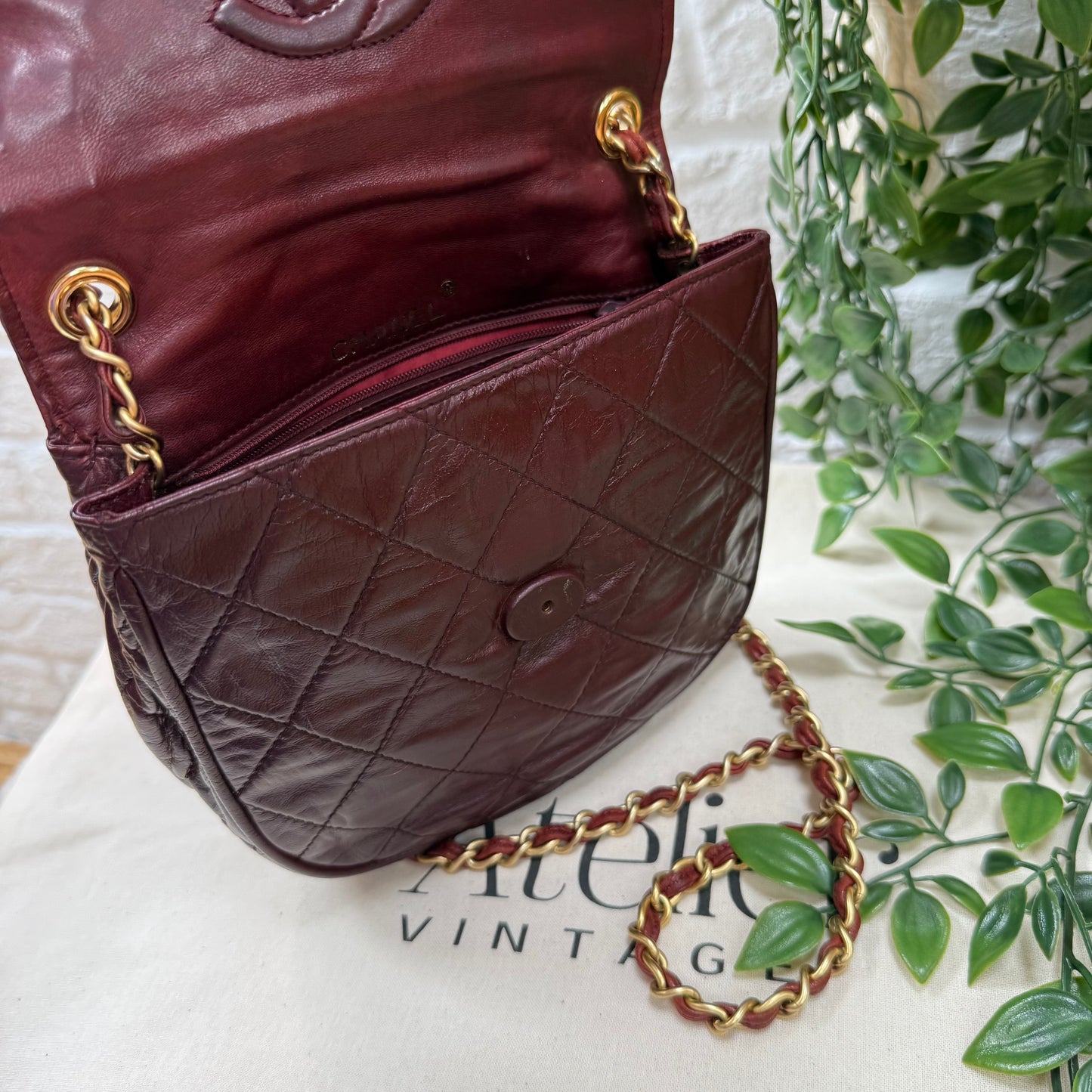 Chanel Early 1980s Bordeaux CC button half moon flap