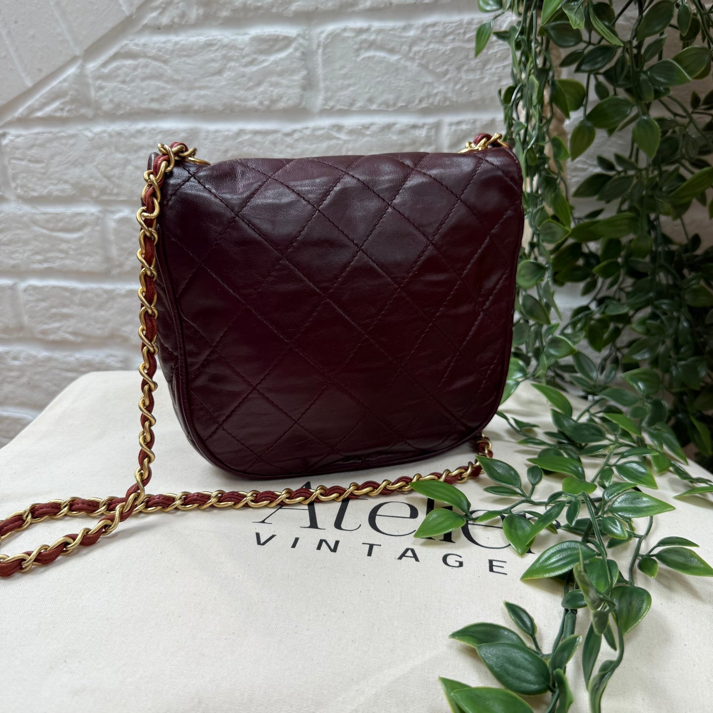 Chanel Early 1980s Bordeaux CC button half moon flap