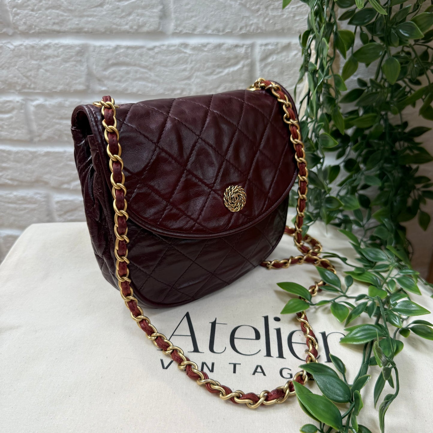 Chanel Early 1980s Bordeaux CC button half moon flap