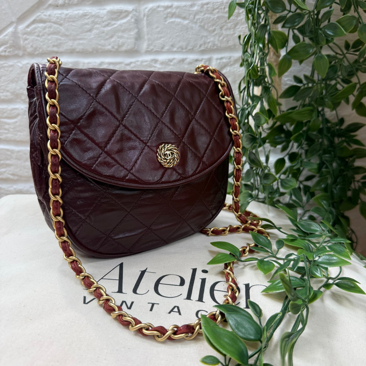 Chanel Early 1980s Bordeaux CC button half moon flap