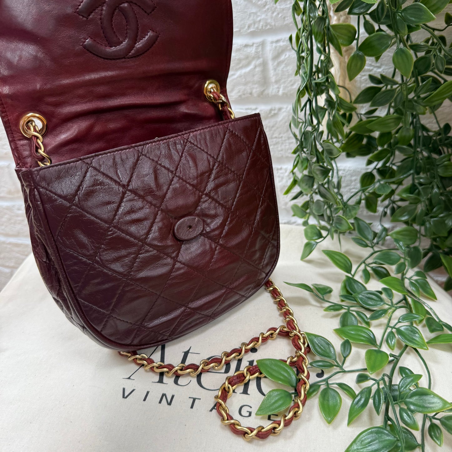 Chanel Early 1980s Bordeaux CC button half moon flap